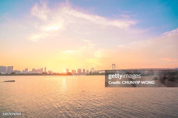 tokyo downtown skyline and rainbow bridge at - dawn skyline stock pictures, royalty-free photos & images