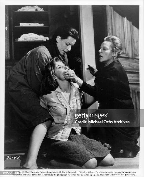 Yootha Joyce helps Tallulah Bankhead silence Stefanie Powers in a scene from the film 'Die! Die! My Darling!', 1965.