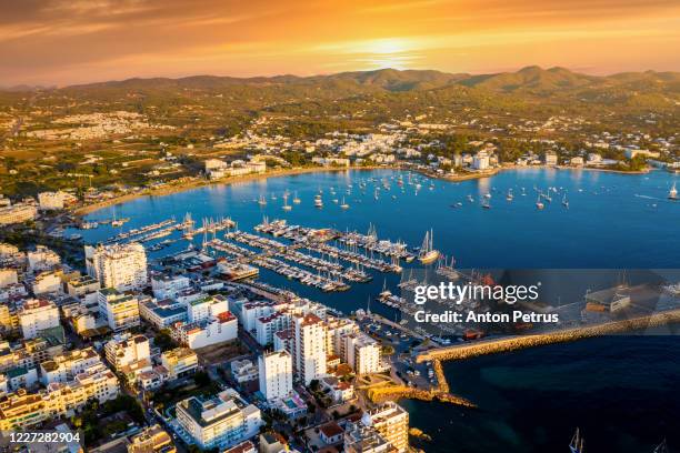 aerial view of san antoni de portmany harbor at sunset. ibiza, spain - sant antoni de portmany stock pictures, royalty-free photos & images