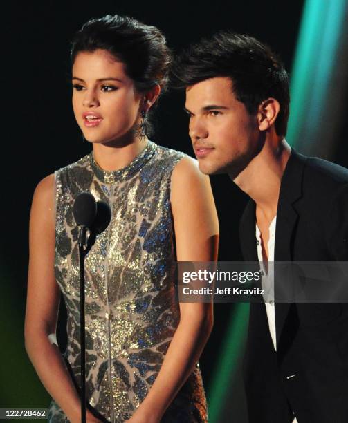 Singer Selena Gomez and actor Taylor Lautner speak onstage during the 2011 MTV Video Music Awards at Nokia Theatre L.A. Live on August 28, 2011 in...