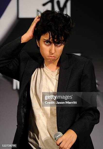 Singer Lady Gaga dressed as "Jo Calderone", winner of Best Female Video Award and Best Video with a Message Award for "Born This Way" poses in the...