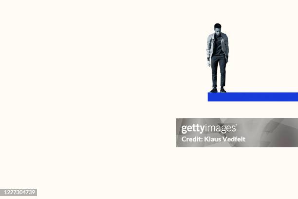 man anticipating while standing on blue ramp - graphic suicide photos stock pictures, royalty-free photos & images