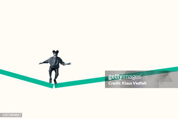 young woman jumping from broken green ramp - nervous person clipart free stock pictures, royalty-free photos & images