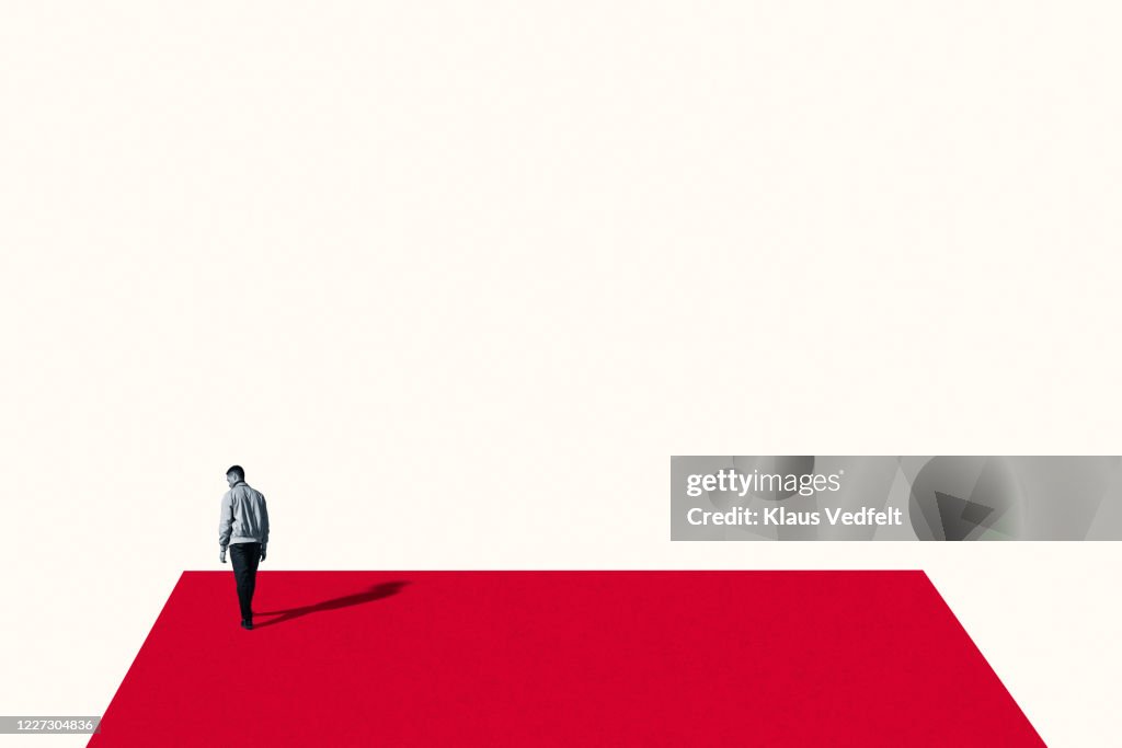 Sad Man Rear View Rear View Of Sad Young Man Walking On Red Ramp High-Res Stock Photo ...