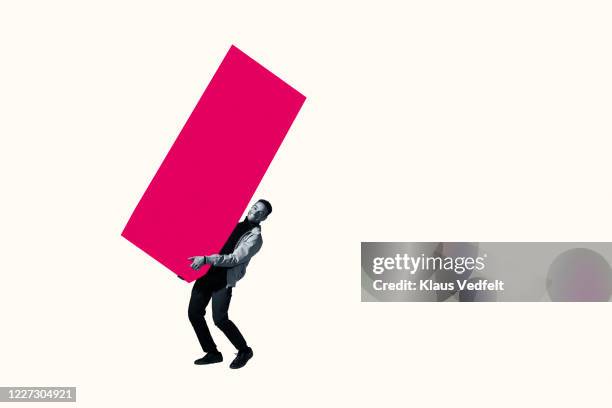 full length of young man carrying pink bar graph - data comparison stock pictures, royalty-free photos & images