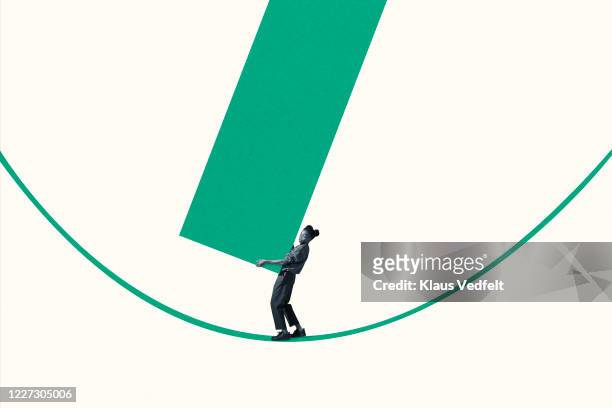 young woman carrying large green bar graph on rope - coronavirus curve stock pictures, royalty-free photos & images