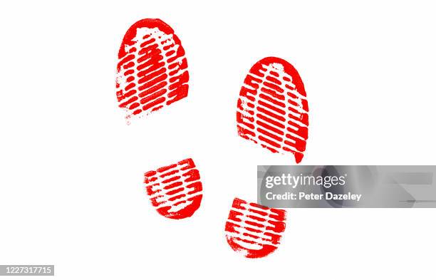 red footprints on white background - shoe print stock pictures, royalty-free photos & images