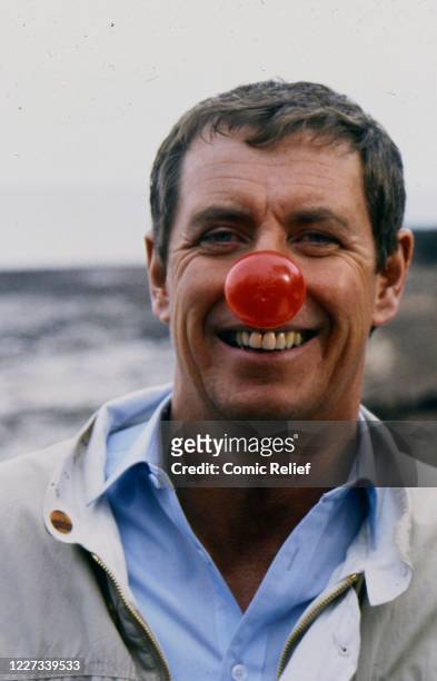 Detective John Nettles wears the Red Nose of 1989 in 1989, England.