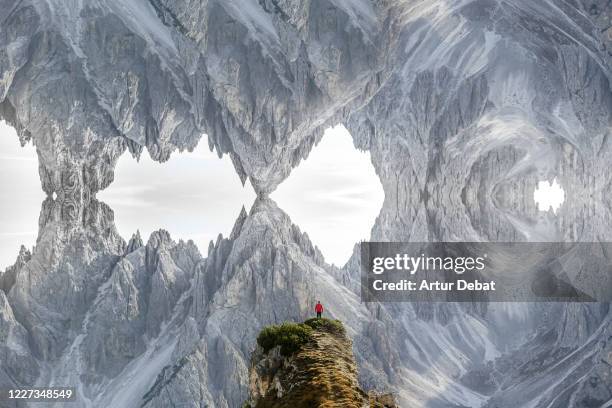 hiker in the alps mountains with stunning mirror effect creating new dimension. - capovolto foto e immagini stock