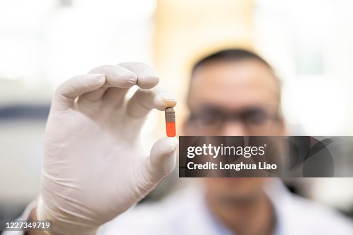 Asian Researchers An Asian Scientist Operates In A Laboratory High-Res Stock Photo ...