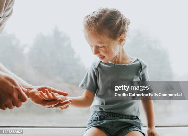 explaining to a child - showing skin stock pictures, royalty-free photos & images