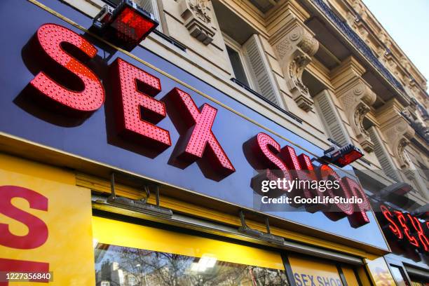 sex shop - the place pigalle in paris stock pictures, royalty-free photos & images