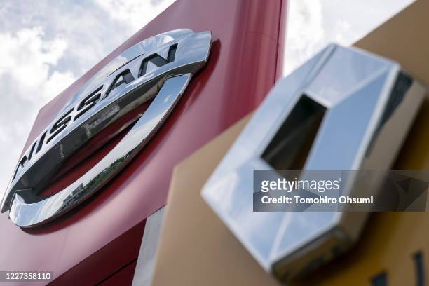 Nissan Motor Co. And Renault SA logos are displayed outside a dealership on May 27, 2020 in Tsukuba, Japan. Nissan and Renault unveiled a revised...