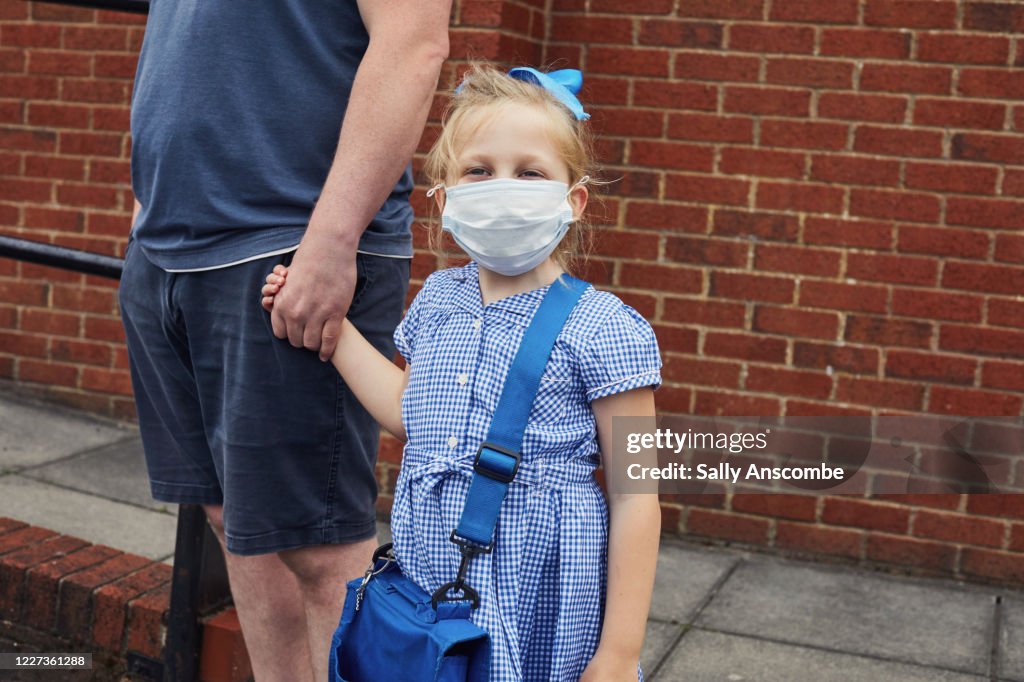 Children going to school wearing face masks