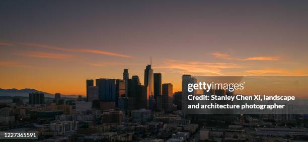 los angeles downtown dawn from air - los angeles skyline stock-fotos und bilder