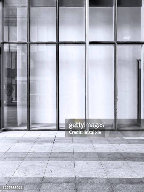 under the setting sun, the facade of modern office building in hangzhou, china - glass entrance stock pictures, royalty-free photos & images