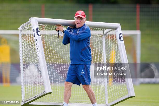 Assistant coach Hermann Gerland carries a training goal during a training session at Saebener Strasse training ground on May 27, 2020 in Munich,...