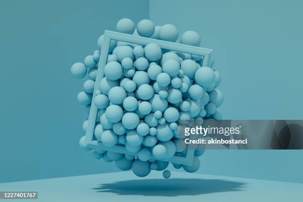 3d abstract flying spheres with frame on blue background - three dimensional stock pictures, royalty-free photos & images