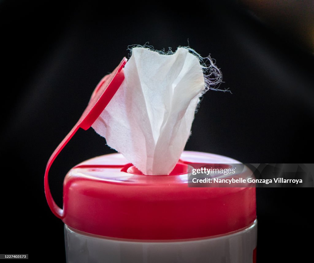 Pink and White coloured plastic container of Disinfectant wipes