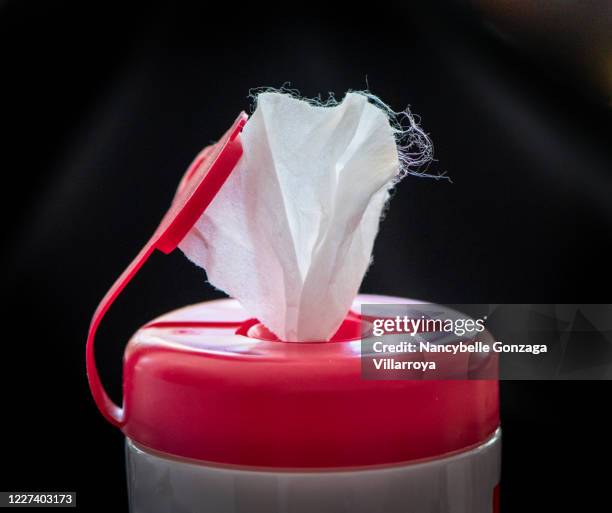 pink and white  coloured plastic container of disinfectant wipes - wet wipe stock pictures, royalty-free photos & images