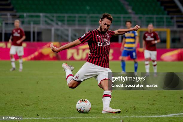 Hakan Calhanoglu of AC Milan scores the fourth goal to make it 4-1 during the Italian Serie A match between AC Milan v Parma on July 15, 2020