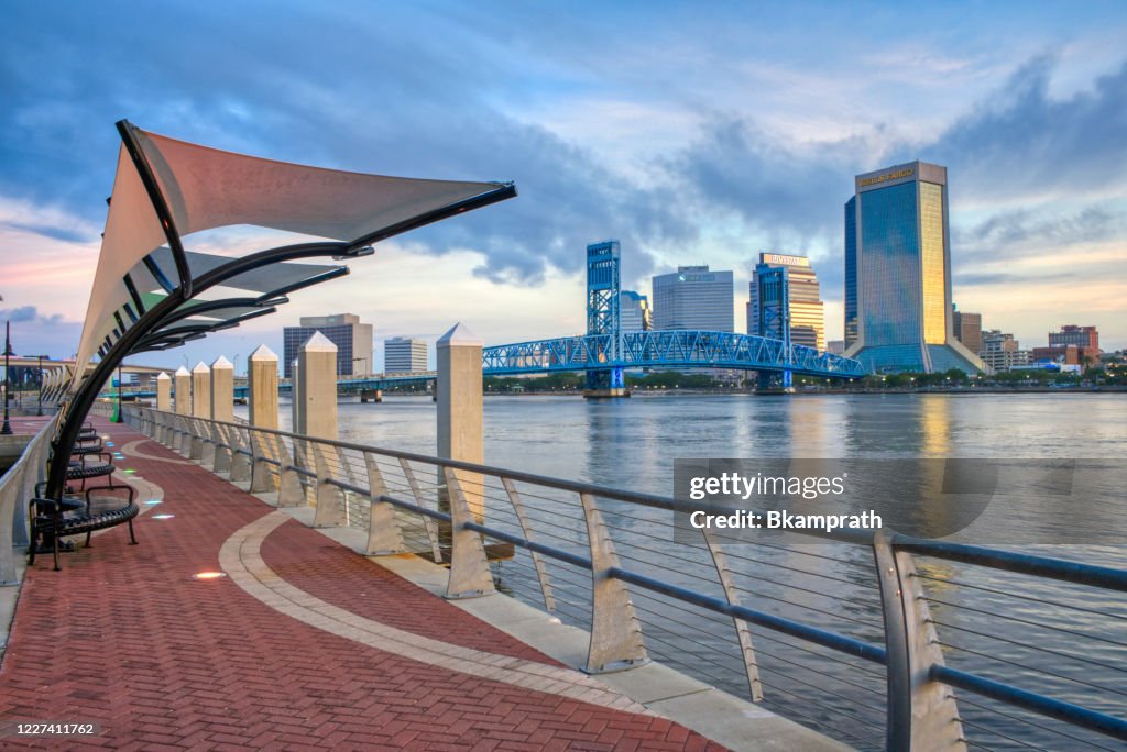 Downtown Jacksonville Skyline at Sunrise as Seen from the Southbank Riverwalk along St. Johns River in Florida
