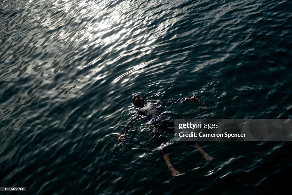 Australian triathlete Aaron Royle floats in Wollongong Harbour... News ...