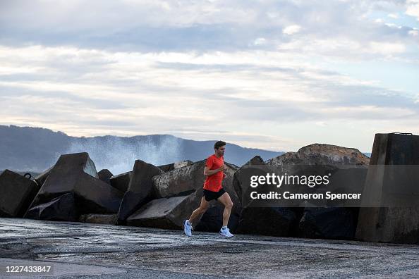Australian triathlete Aaron Royle runs during a training session ...