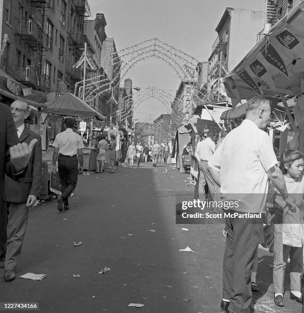 View along Mulberry Street as people stop at various booths during the Feast Of San Gennaro Festival, in the Little Italy neighborhood, New York, New...