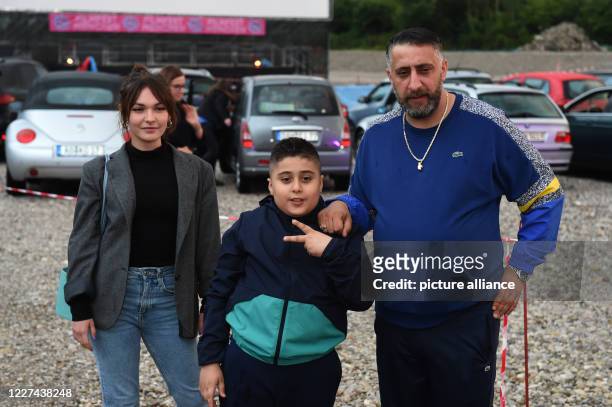 July 2020, Bavaria, Munich: Leading actress Emma Drogunova Director and leading actor Kida Khodr Ramadan and his son "Momo" pose before the premiere...