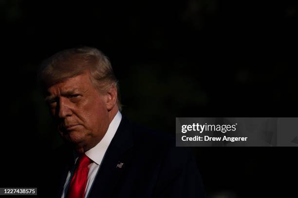 President Donald Trump walks to the White House residence after exiting Marine one on South Lawn of the White House on July 15, 2020 in Washington,...