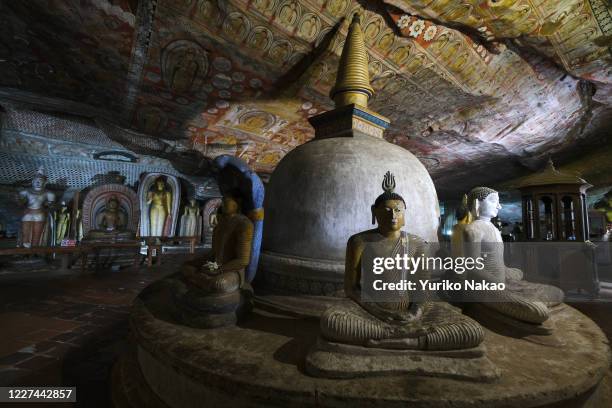 Buddha statues are pictured at the Rangiri Dambulla Cave Temple, or Rock Temple, on April 10, 2019 in Dambulla, Sri Lanka. The cave monastery is a...