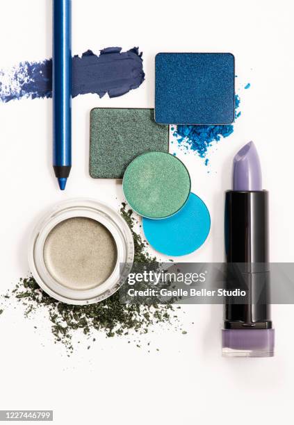 arrangement of eye make-up, lipstick, swatches, and smear - rossetto marrone foto e immagini stock