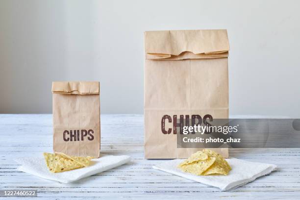 same portion of chips for the large & small bag - serving size stock pictures, royalty-free photos & images