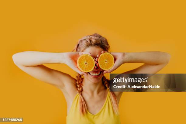 oranges in her eyes - vitality food stock pictures, royalty-free photos & images