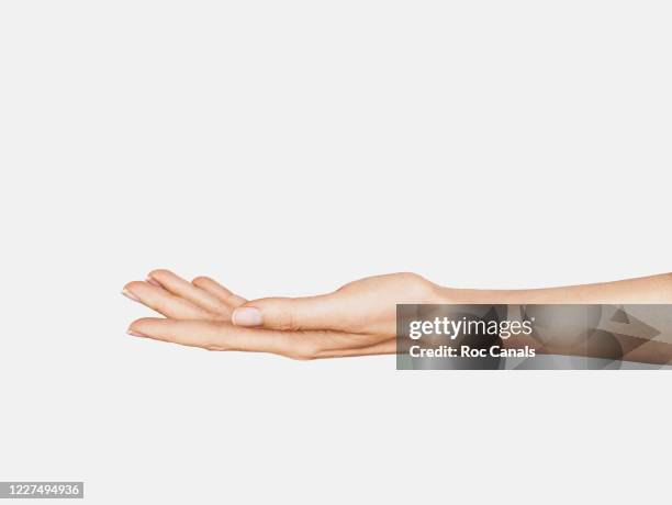 hand holding - stretching fingers stock-fotos und bilder