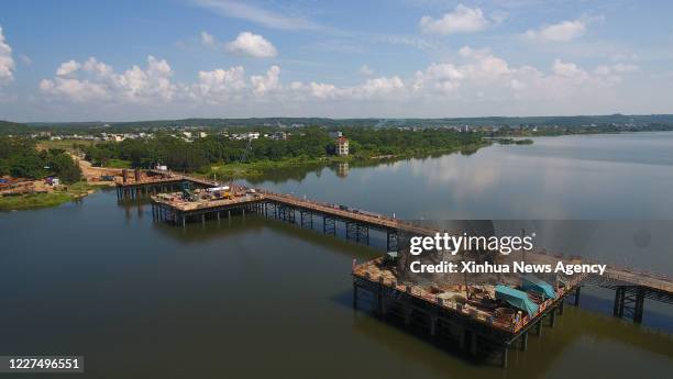 July 15, 2020 -- Aerial photo taken on July 15, 2020 shows the construction site of the Nandu River grand bridge of the Wenchang-Lingao national road...