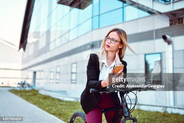 elegant female taking selfie while riding bicycle - classic press conference stock pictures, royalty-free photos & images
