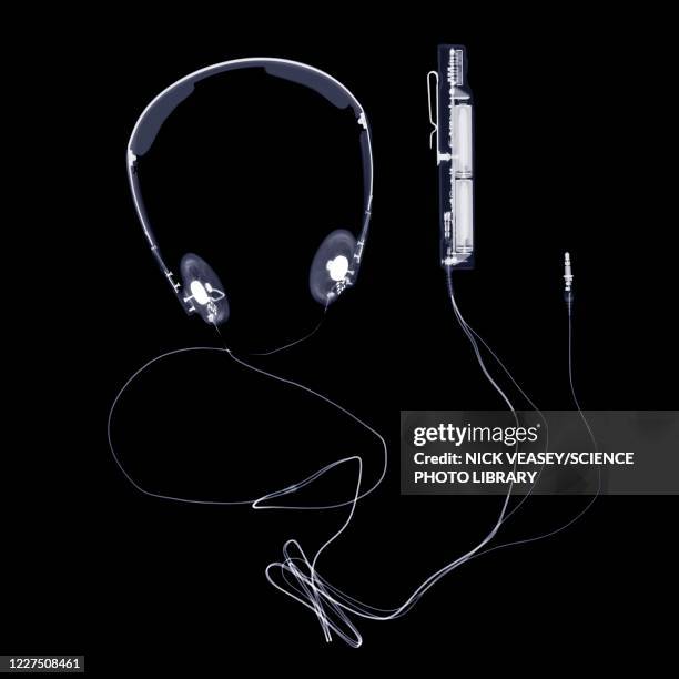 headphones and volume control, x-ray - in ear headphones stock-fotos und bilder