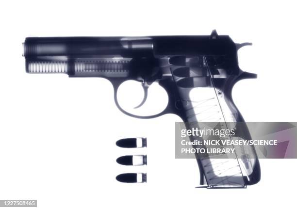 handgun and bullets, x-ray - revólver imagens e fotografias de stock