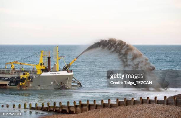 dredger used to return lost sand to eastbourne beach, east sussex - dredger stock pictures, royalty-free photos & images