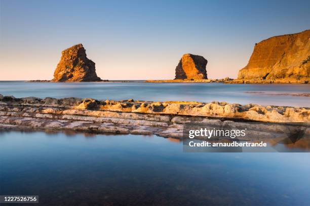 the twin rocks at sunset, hendaye, pyrenees-atlantiques, aquitaine, france - bayonne imagens e fotografias de stock