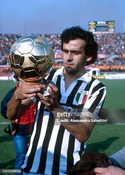 Michel Platini of Juventus celebrates in Turin after winning the golden ball during the Serie A at Stadio Comunale in Turin, Italy.