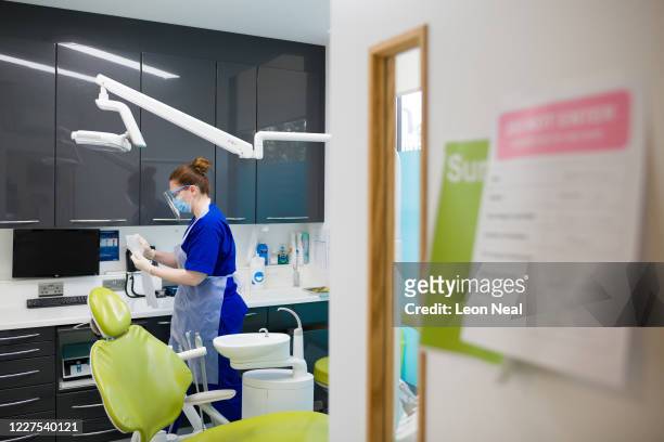 Dental Nurse Johanna Bartha disinfects one of the six surgery rooms at East Village dental practice following a procedure with a patient on May 28,...