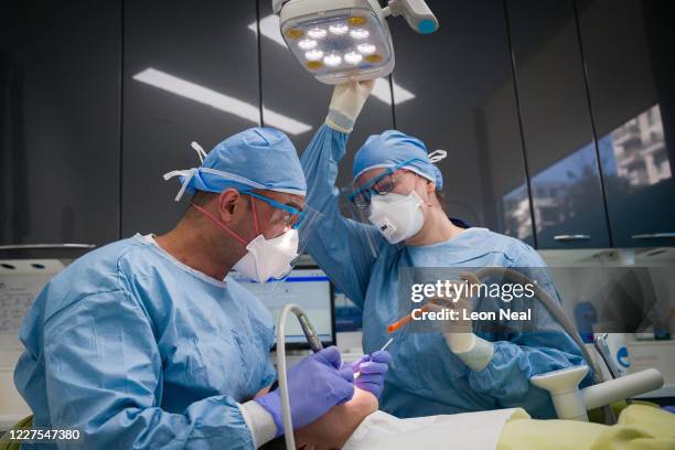 Dentist Fiez Mughal and Dental Nurse Johanna Bartha carry out a procedure on a patient in one of the six surgery rooms at East Village dental...