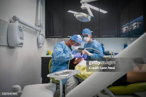 Dentist Fiez Mughal and Dental Nurse Johanna Bartha carry out a procedure on a patient in one of the six surgery rooms at East Village dental...