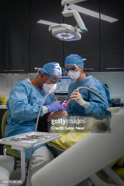 Dentist Fiez Mughal and Dental Nurse Johanna Bartha carry out a procedure on a patient in one of the six surgery rooms at East Village dental...