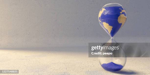 hourglass with sand pattern of countries of the world - hourglass stock pictures, royalty-free photos & images