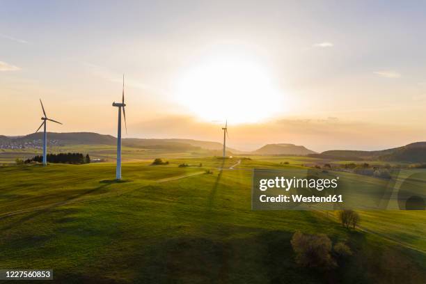 germany, baden-wurttemberg, burladingen, aerial view of countryside wind farm at sunset - baden württemberg stock pictures, royalty-free photos & images