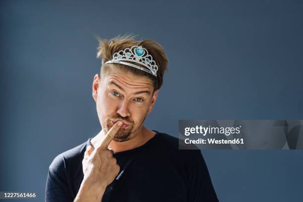 portrait of a bearded man wearing a tiara - unexpected stock pictures, royalty-free photos & images